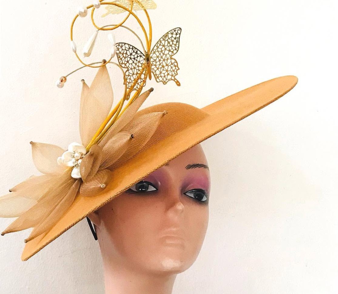 Gold occasion hat with butterfly and pearl details